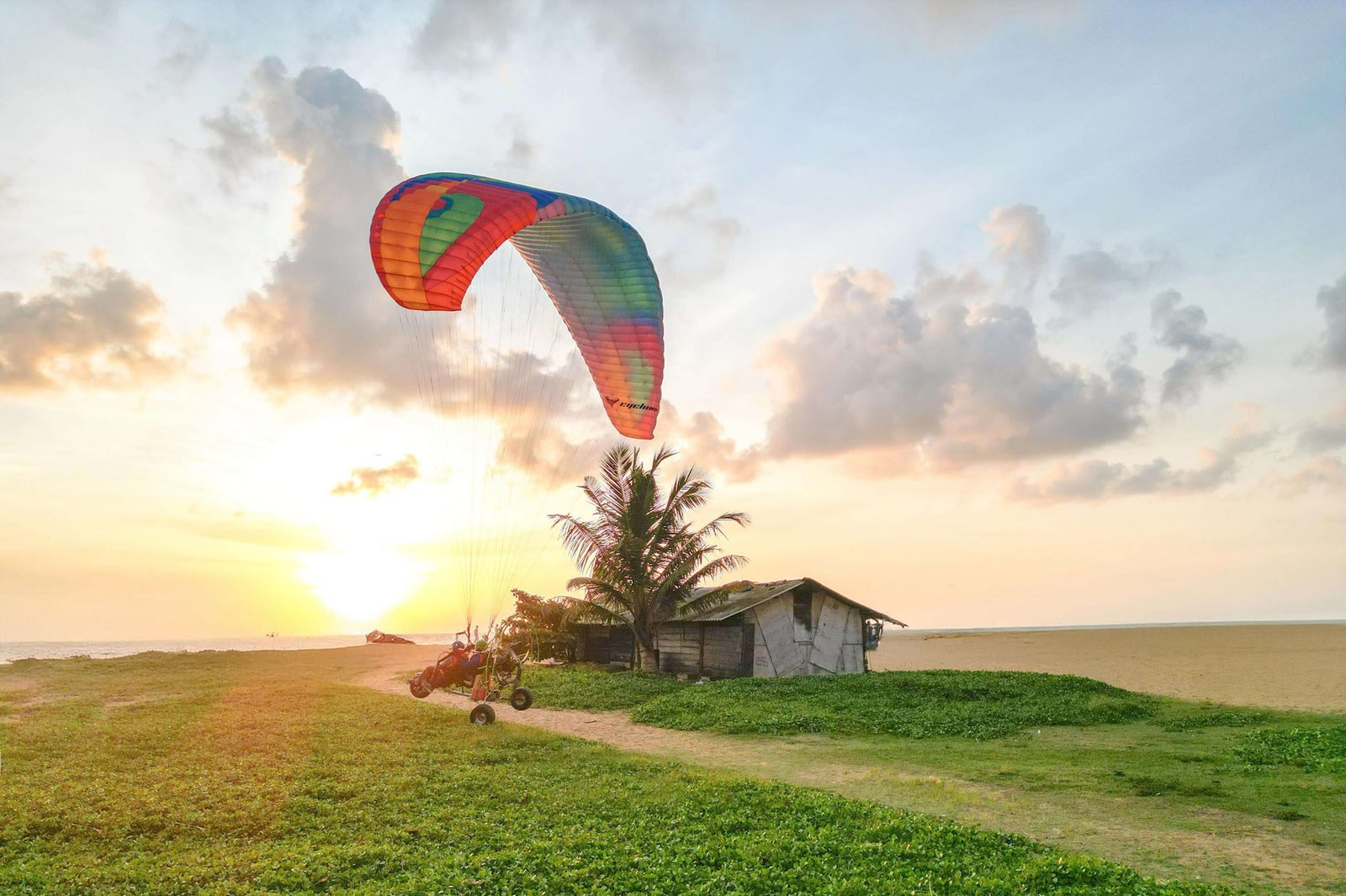 Happy passenger and pilot on a tandem paramotor flight